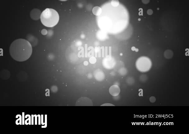 Abstract black and white bokeh motion background with glowing sphere ...