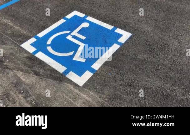 ADA handicapped sign with handicapped wheelchair symbol marks ...