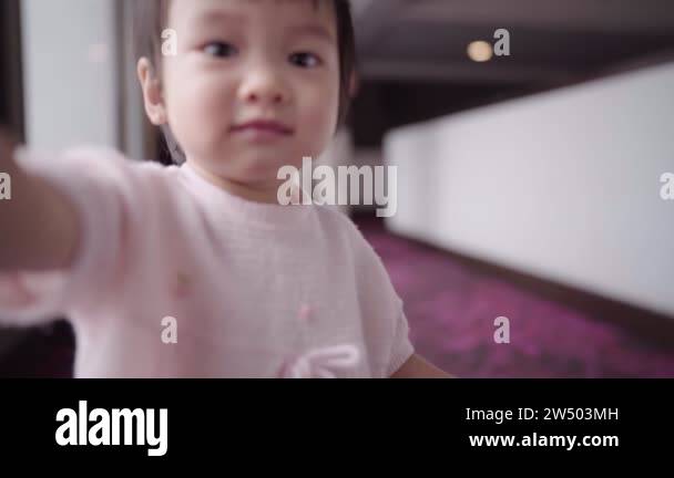 Asian adorable little girl smiling chasing following camera, child ...