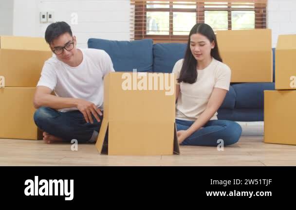 Happy Asian young family homeowners bought new house. Korean Mom, Dad ...