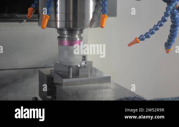 Automated cnc turning milling machine cutting metal workpiece at ...