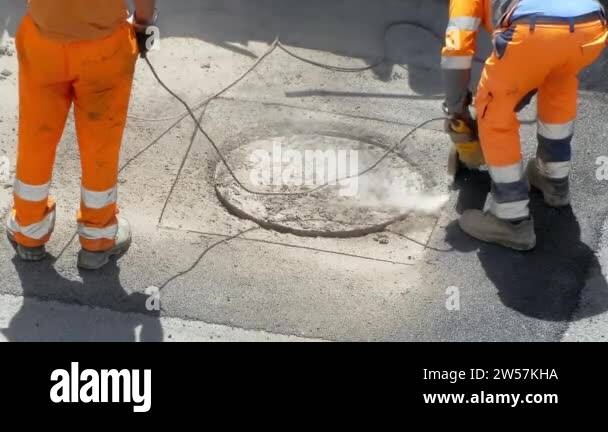 Drilling works on the construction site, unrecognizable workers in ...