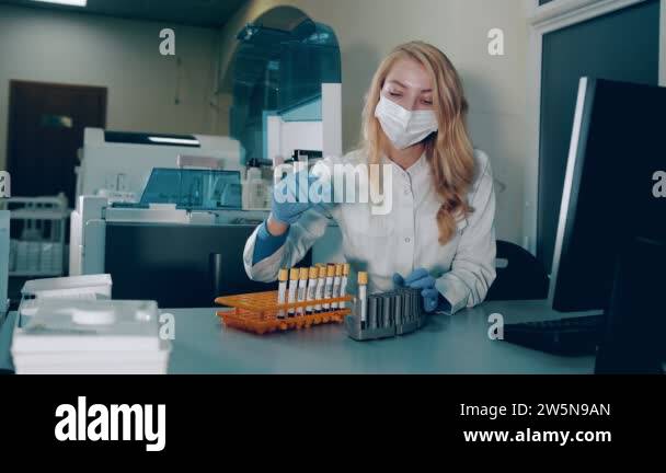 Blood test in the laboratory. The lab technician examines the blood ...