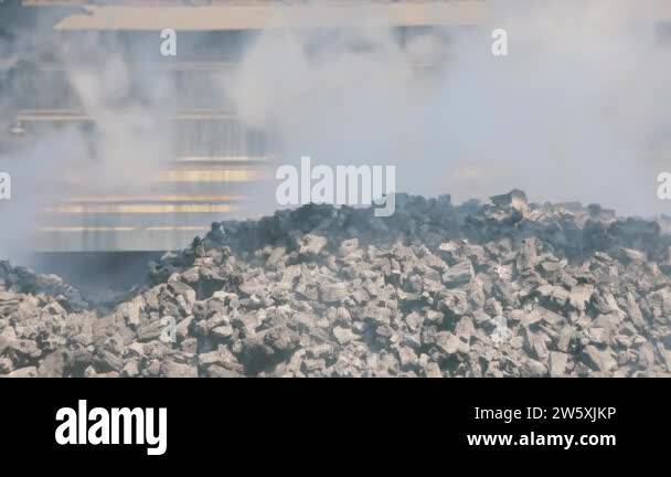 Smoke from hot coke oven coal. Coke oven battery, coke oven coal