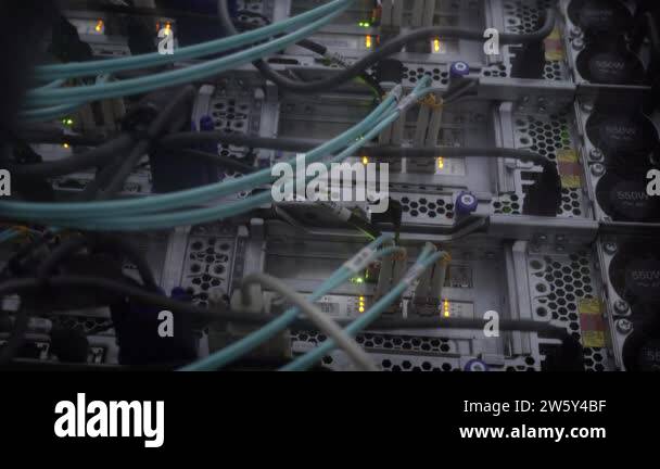 Close up fiber optic in server room. Bottom view Network cables ...