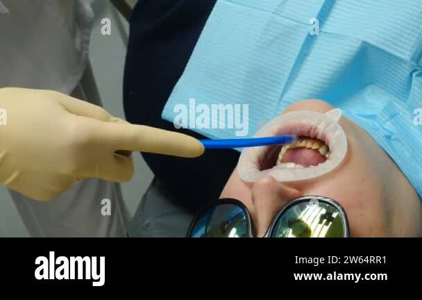Modern dental clinic. Orthodontist preparing jaw for dental crowning or ...