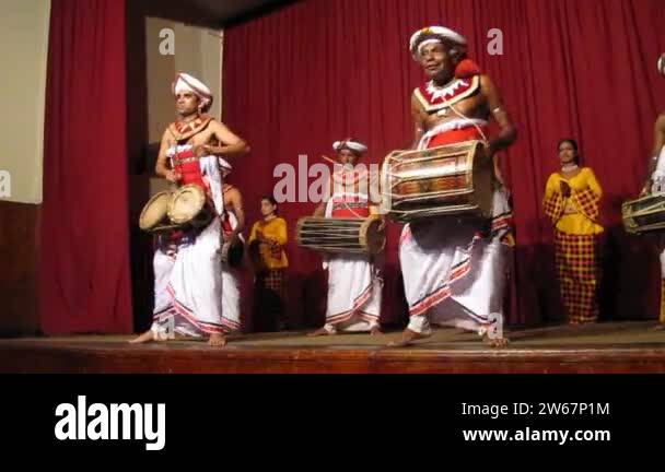 Solo of two drummers in national costumes of Sri Lanka. Tourist show in