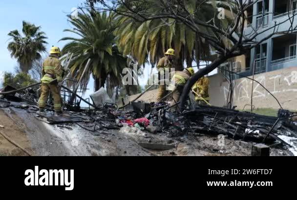 Los Angeles, CA USA - March 26, 2021: Fireman putting out a fire in a ...