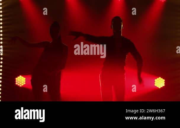 Young couple dancing ballroom dance elements. Rumba, salsa, tango ...