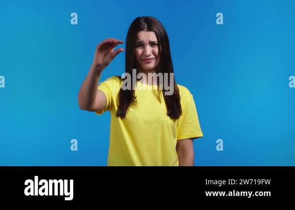 Young woman showing difference between invisible abstract subject or ...