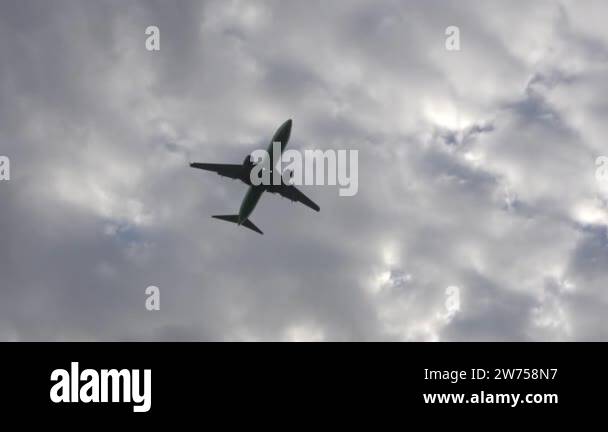 Airplane flight in the sky in cloudy cloudy summer weather. The plane ...