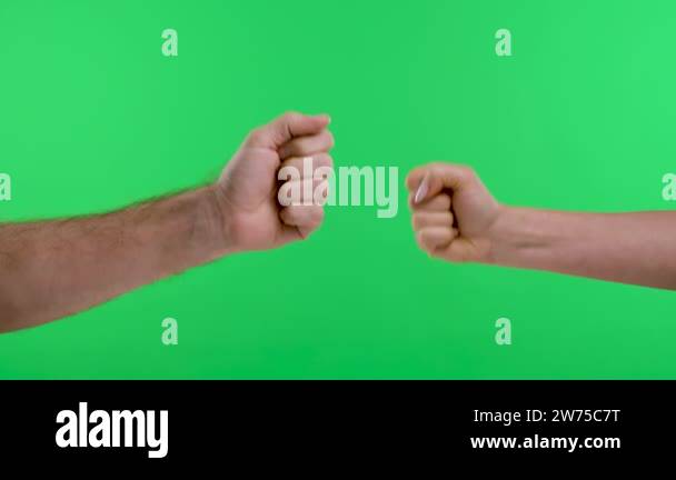 A woman, a man are playing rock paper scissors against the background ...