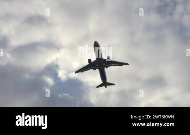 Airplane flight in the sky in cloudy cloudy summer weather. The plane ...