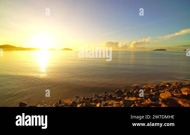 Amazing sunlight over sea sun ray and sunset or sunrise over the calm ...