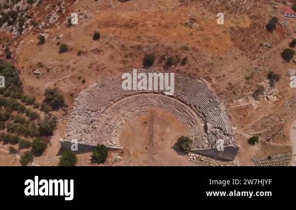 the ancient city of Letoon with an amphitheater and a ruined temple of ...