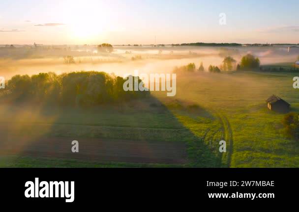 Rural village with a house, aerial view landscape. Fog morning over the ...