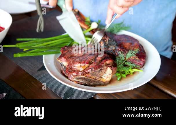 Man cuts cooked fried Stock Videos & Footage - HD and 4K Video Clips ...