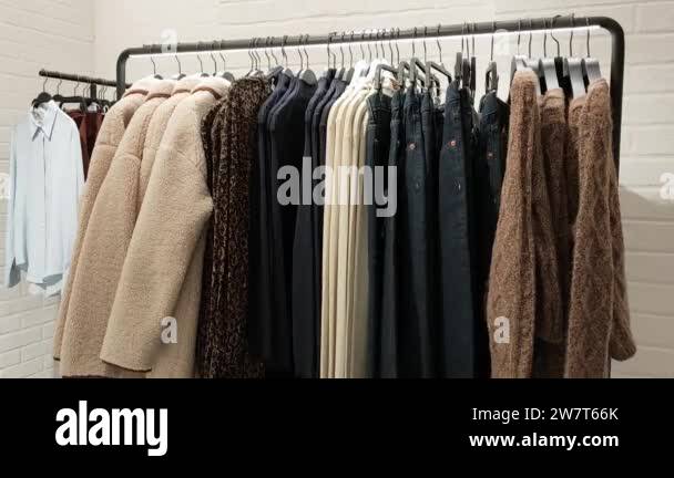 Top view of a rack with an autumn collection of womens clothing in a ...