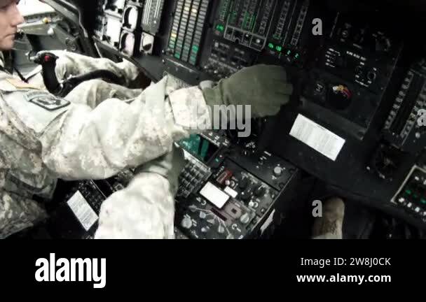 Black Hawk copilot looking at and adjusting instruments Stock Video ...