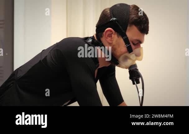 Professional athlete measuring heart rate in medical science lab ...