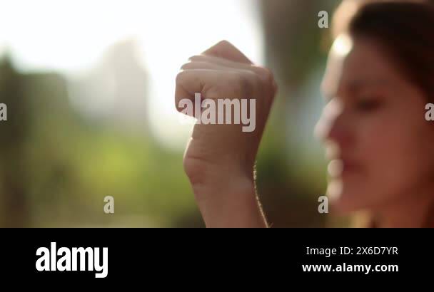 Two people joining hands in union outdoors. Teamwork concept symbol ...