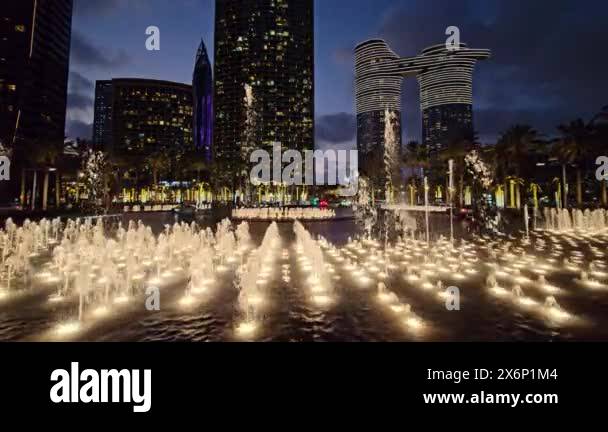 Illuminated Water Fountains at Night in Urban Park, Water fountains ...
