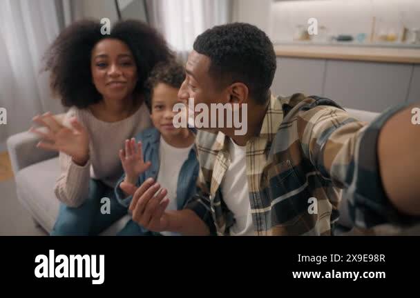 Happy family African American man woman male female parents little boy ...