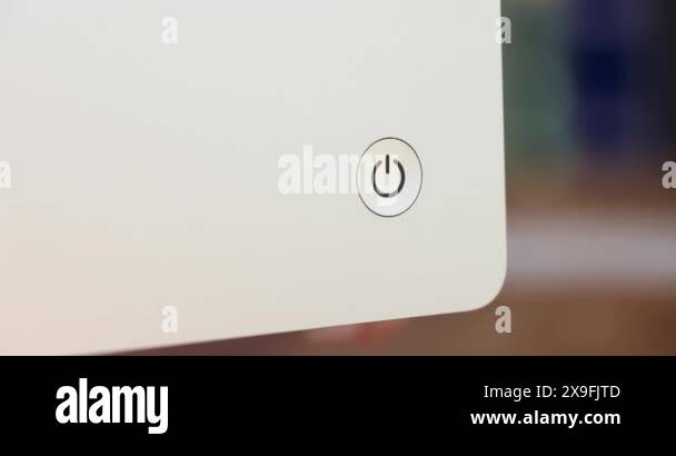 Woman presses power button on screen. Computer monitor power up concept ...