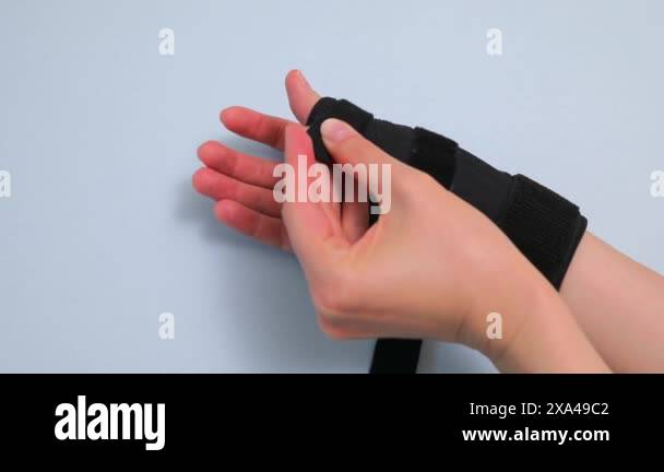 Someone Applies Adjustable Wristband Arm Support, Thumb Joints And ...