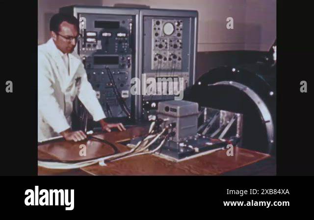 Men.com Plug In 1962 - Men plug in heavy wires while working on Project Gemini at ...