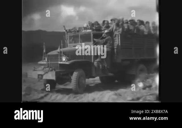 1945 - A truck full of Japanese prisoners arrives at a POW camp on ...