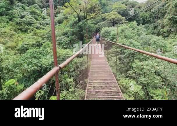 Man crossing suspension bridge Stock Videos & Footage - HD and 4K Video ...