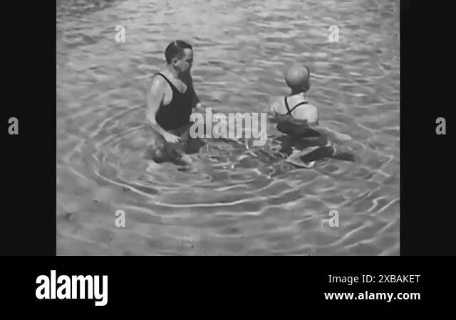 A beginning swimmer swims using a hand stroke called finning, in ...