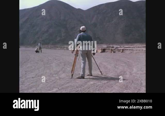 Men work constructing different parts of the antenna in Peru in 1963