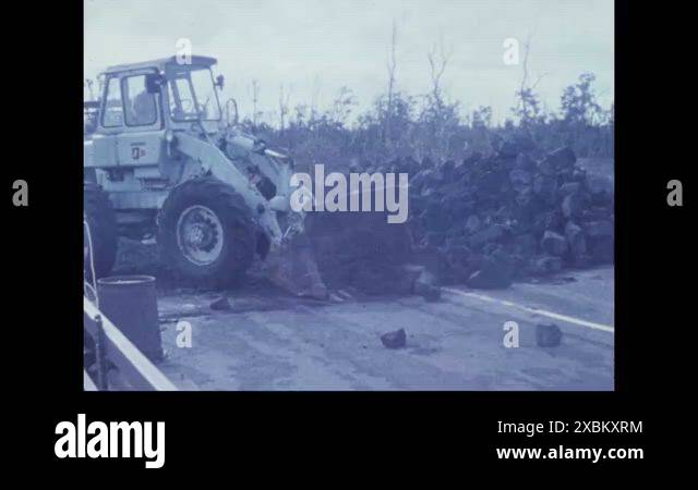 1973 - Construction plows are used to shift rocks in the aftermath of ...