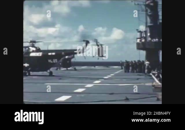1952 - Helicopters take off from the USS Rendova to survey the ...