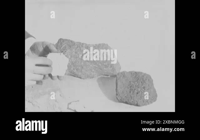 1920 - Rocks of bauxite and coke and crude materials being loaded into ...