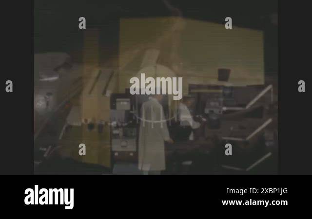 1963 - Atomic workers use a research reactor in a nuclear power plant ...