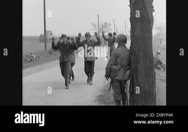 1945 - German POWs surrender to American soldiers, and they carry one ...