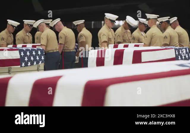U.S. service members conducting repatriation ceremony of the remains ...
