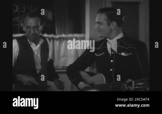 1937 - In this western film, a deputy (Gene Autry) makes paper dolls ...