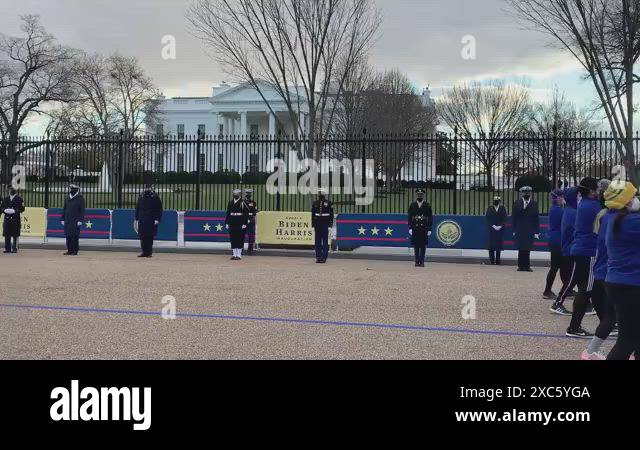 2021 A fleet of Black SUV's and soldiers in front of the White House ...