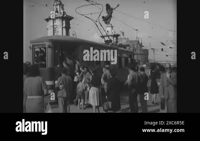 1944 - Street scenes in Rome, including people riding at the back of a ...