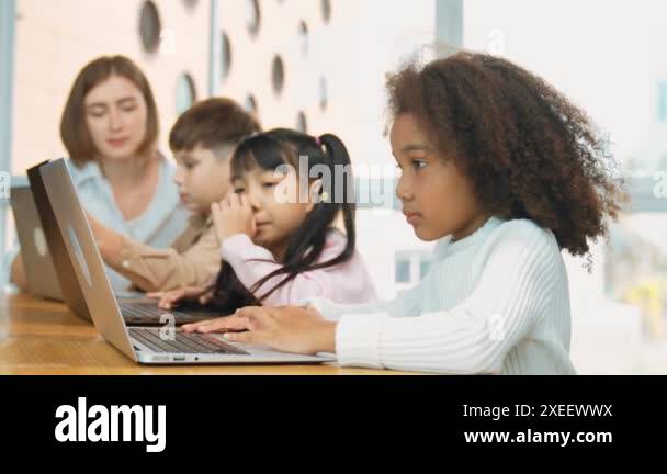 Smart teacher check student answer while learner using laptop to doing ...