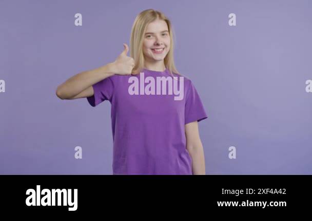 Stylish woman with hand sign like, thumbs up gesture. Happy lady ...
