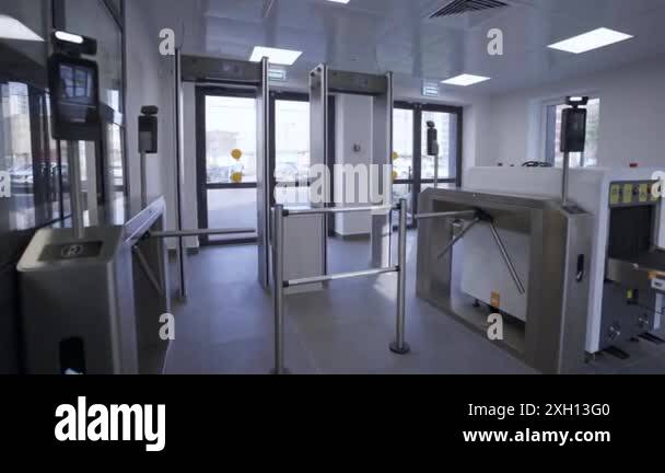 Modern checkpoint situated at entrance to building. Checkpoint features ...