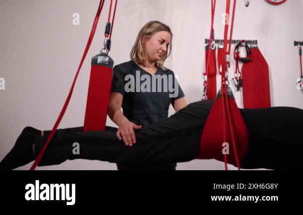 Image showcasing Physical therapy practitioner, Safety strap system, Patient table ...