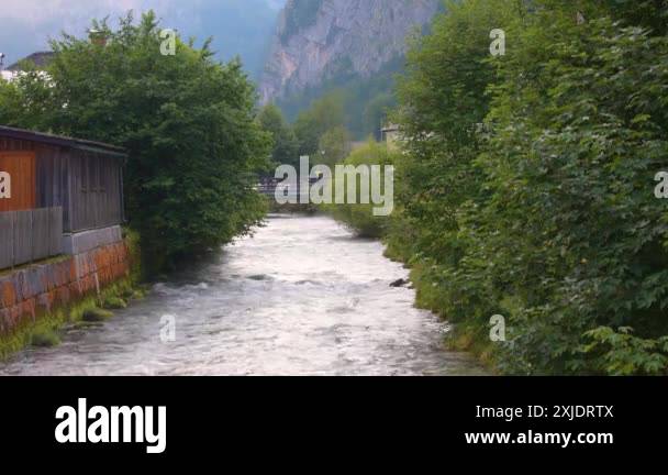 House at the river, Hallstatt, Austria. Riverside. Crystal clean ...