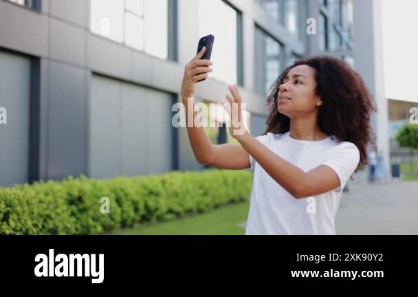 Upset woman with dark bushy hair searching for connection while ...
