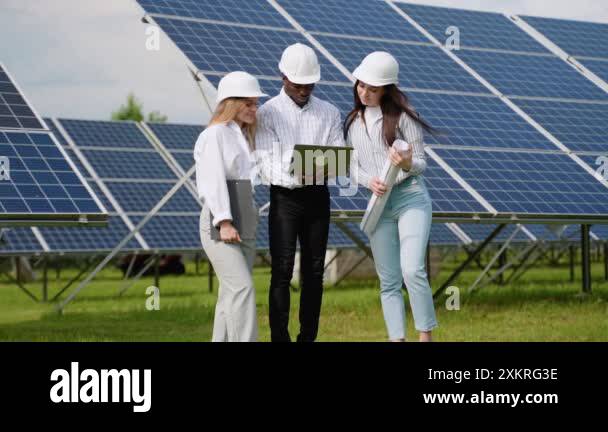 Three multiracial diverse females and male electrician engineers in ...